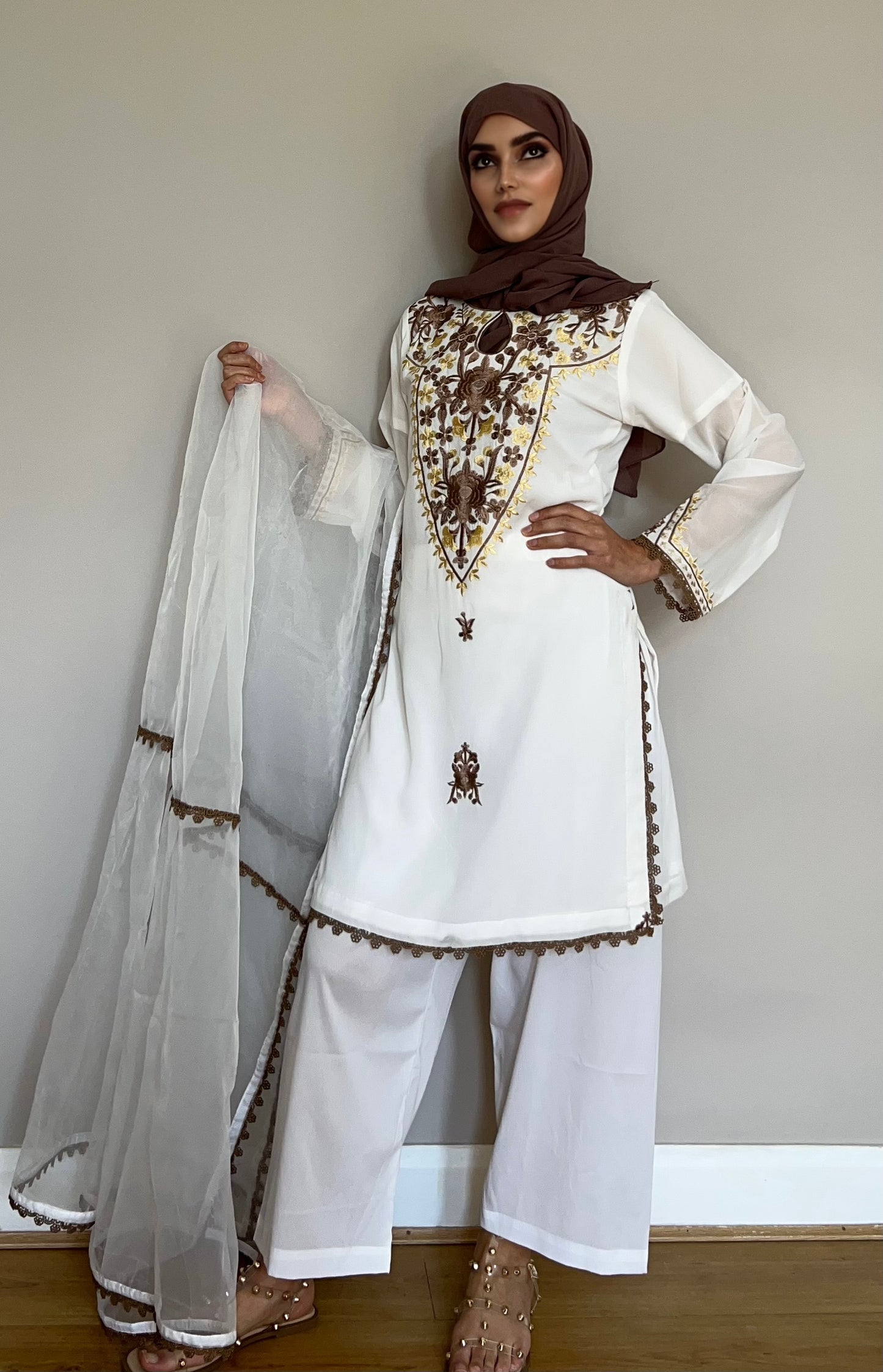 Wide-leg trousers paired with a chiffon kameez and matching organza dupatta.